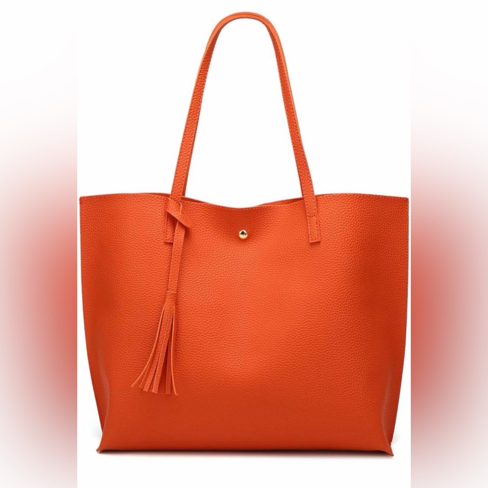 Large orange faux leather tote handbag.